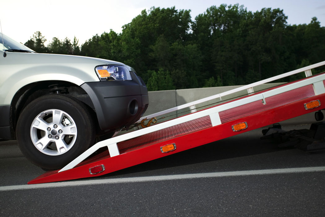 SUV Being Loaded Onto A Tow Truck